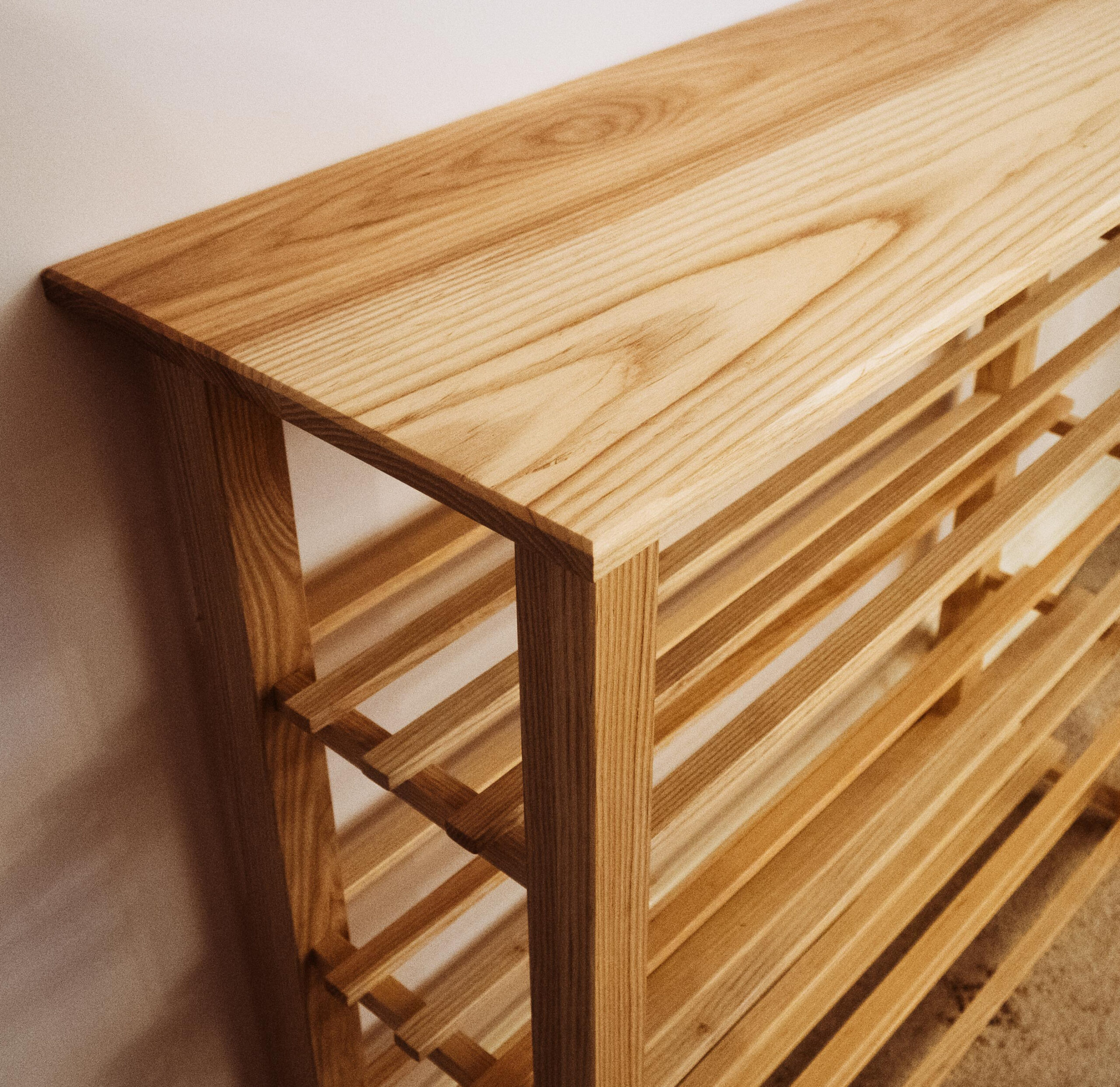 Bespoke slatted shoe storage.